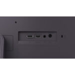 Full desktop setup featuring the LG UltraGear 24G411A-B gaming monitor with peripherals